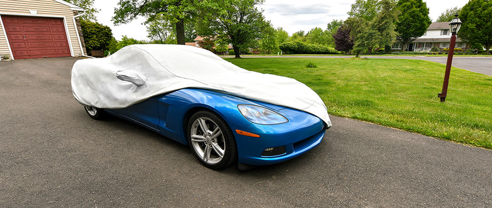 Image of a corvette with a car cover