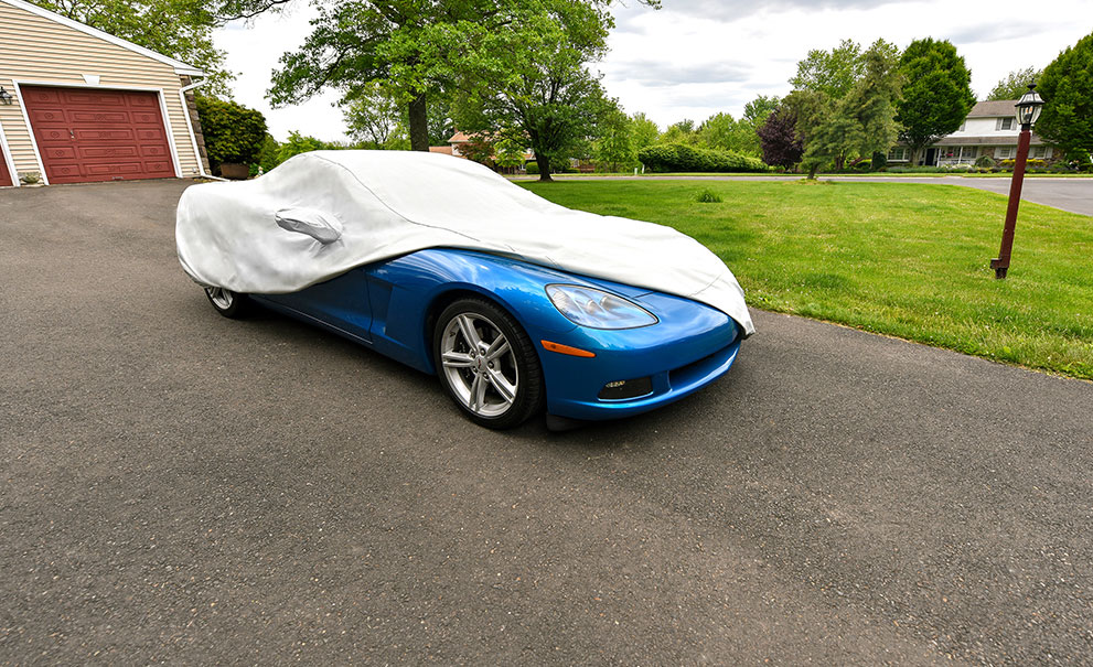 Image of a corvette with a car cover